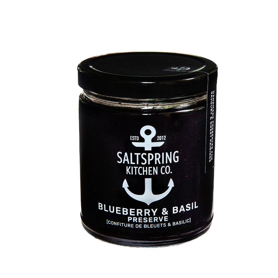 Jar with black label and black lid with Salt Spring Kitchen Co. logo and text reading "Blueberry and basil preserve".