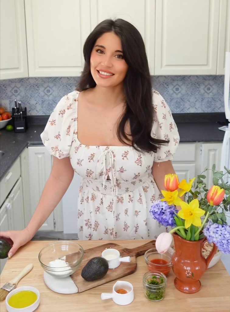  Buy BC Brand Ambassador, Chanelle Saks Sullivan standing in her home kitchen with whole ingredients in front of her ready to be prepared. 